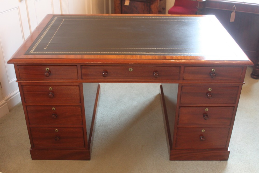 A fine mahogany partners desk by Miles & Edwards