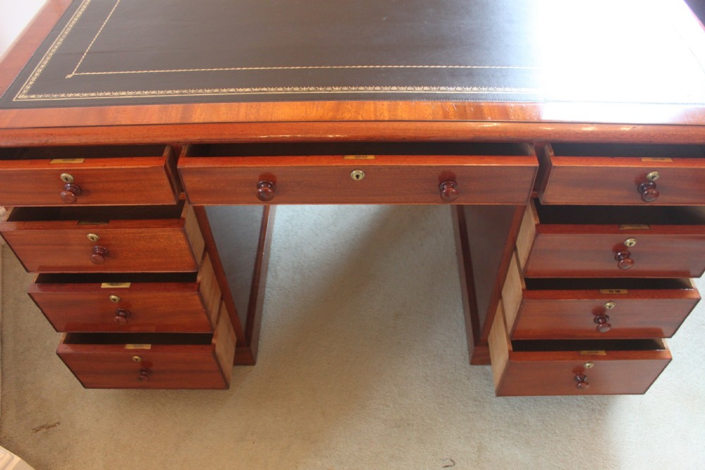 A fine mahogany partners desk by Miles & Edwards View XI