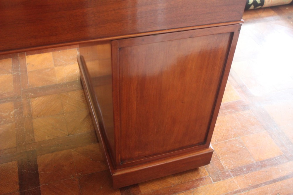 Victorian mahogany pedestal desk with a dark green leather inset top and nine drawers with turned handles. View XII