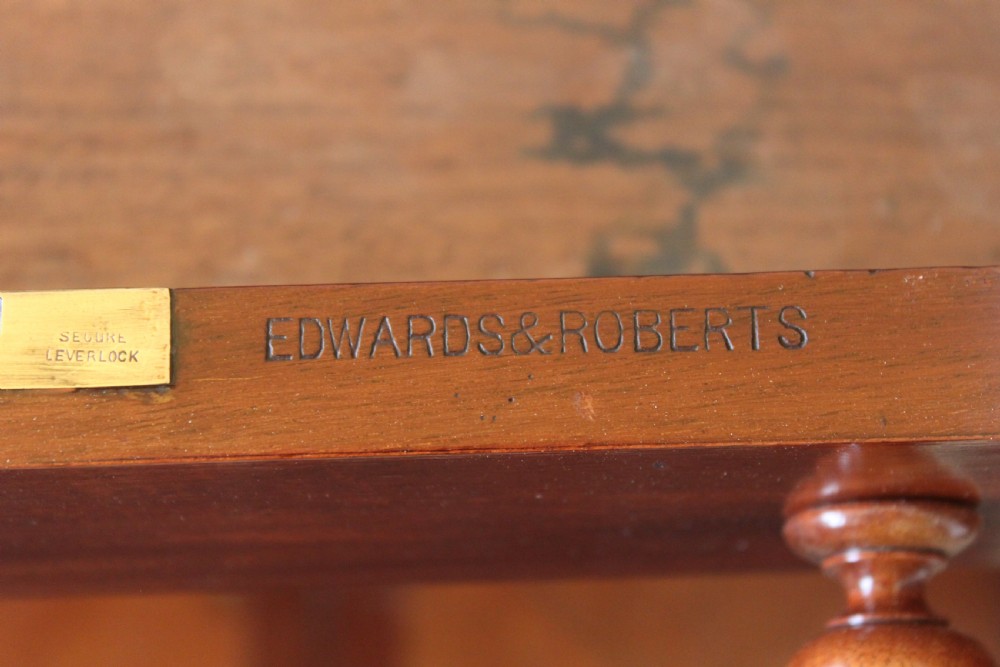 Victorian mahogany pedestal desk with a dark green leather inset top and nine drawers with turned handles. View XV