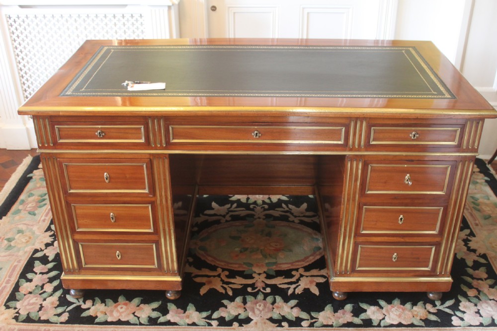 A 19th Century French mahogany and brass inlaid pedestal desk