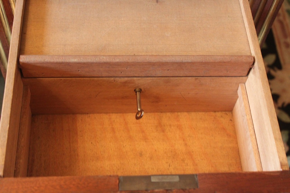 A 19th Century French mahogany and brass inlaid pedestal desk View XII