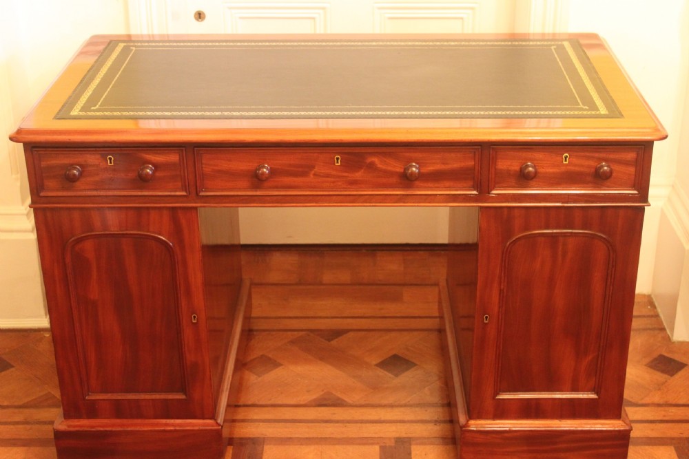An unusal Victorian mahogany pedestal desk