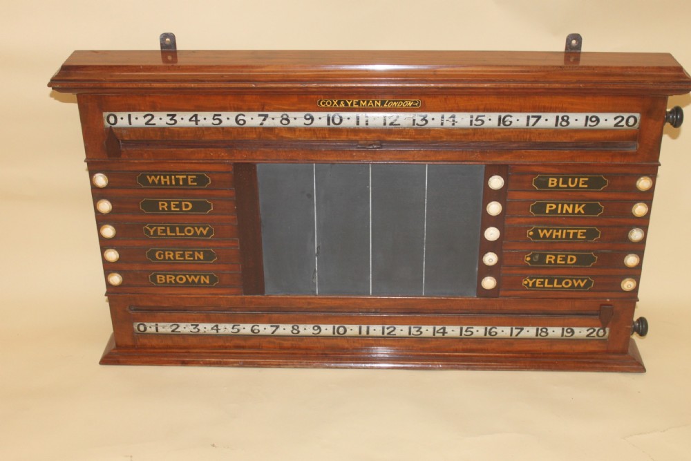 An antique mahogany snooker and life pool scoreboard featuring rolling number dials, colour name plaques, and a central slate panel.