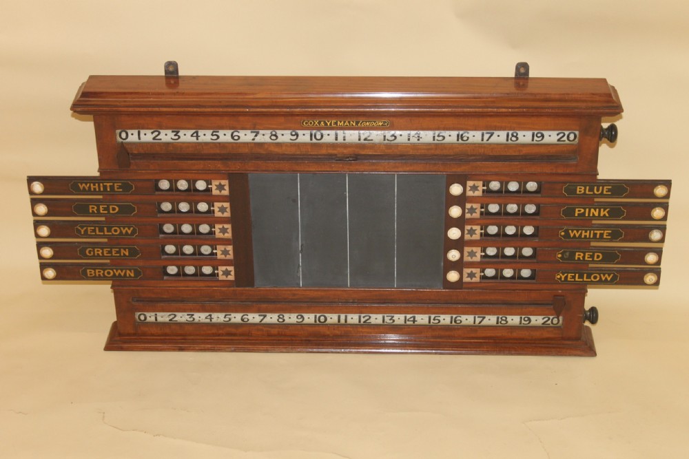 An antique mahogany snooker and life pool scoreboard featuring rolling number dials, colour name plaques, and a central slate panel. View II