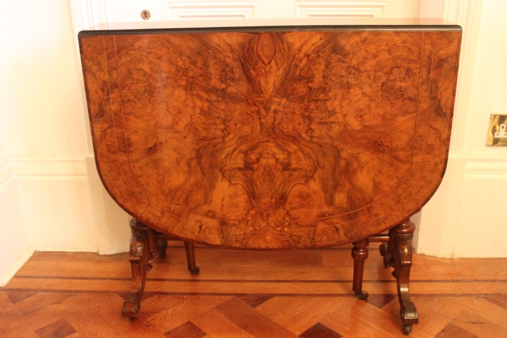 A Victorian burr walnut and inlaid Sutherland table