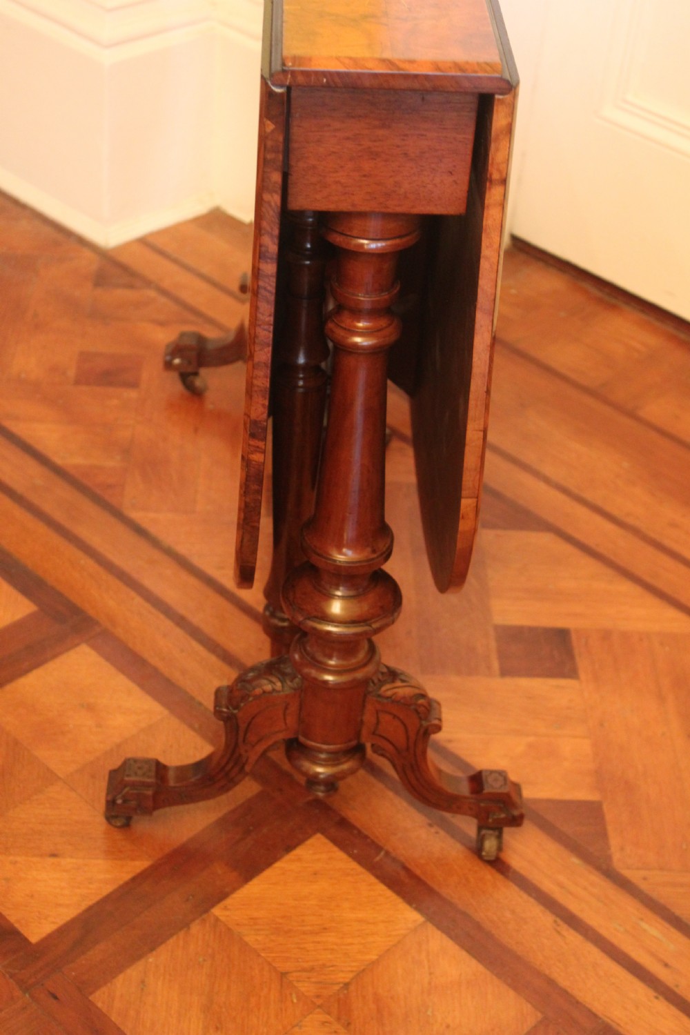 A Victorian burr walnut and inlaid Sutherland table View II