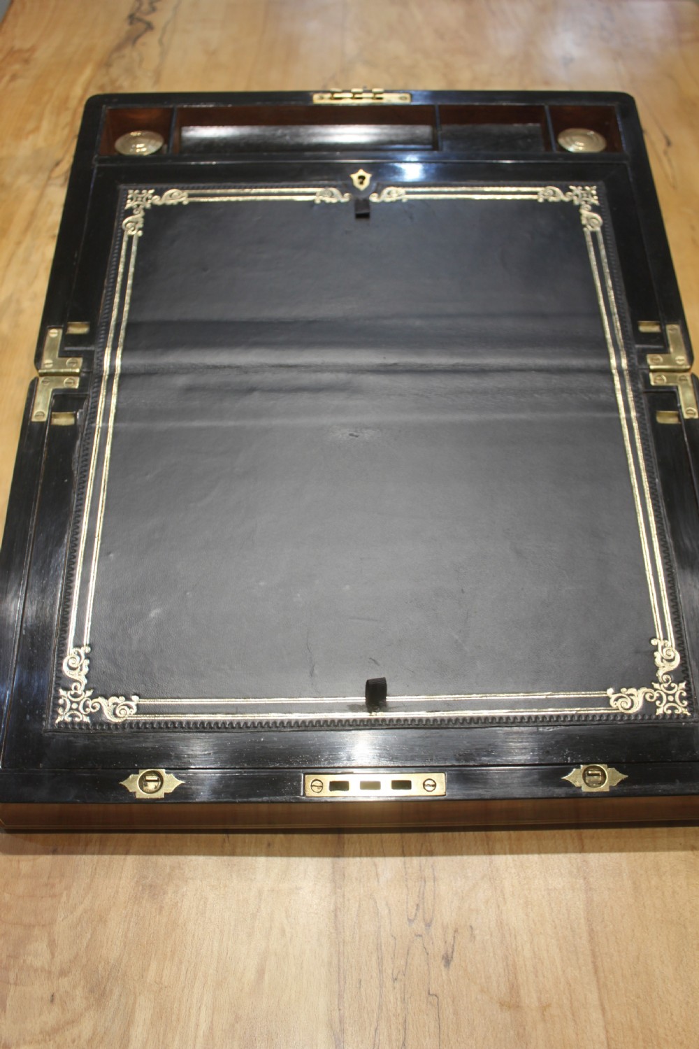 Victorian walnut writing slope, brass bound with secret drawers View V
