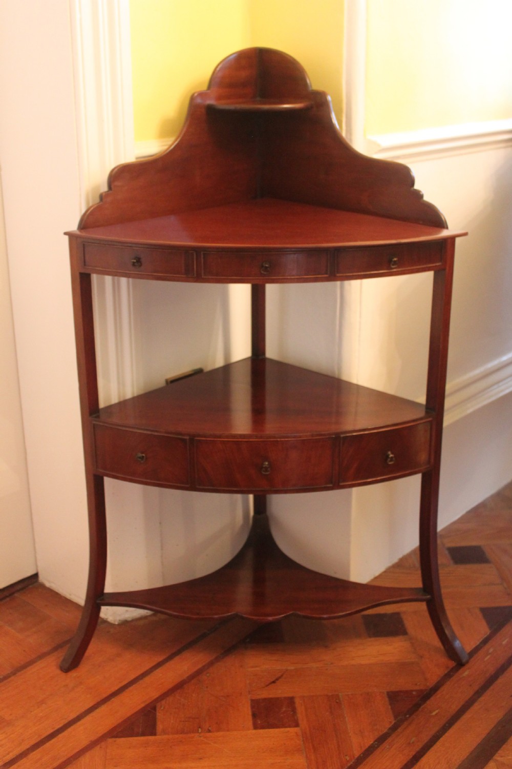 A George III period two tier mahogany  corner wash stand View II