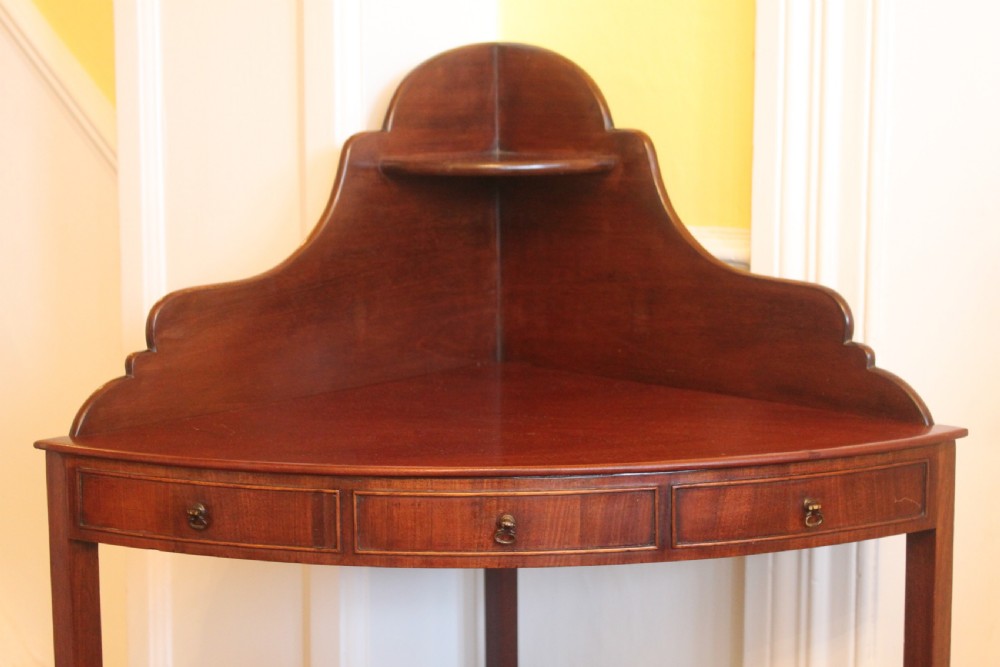 A George III period two tier mahogany  corner wash stand View III