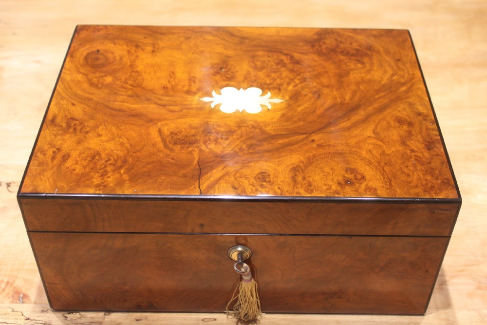 A Victorian burr walnut writing slope with secret drawers & Bramah lock