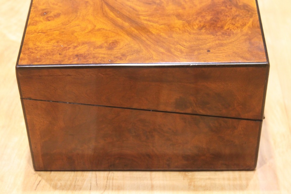 A Victorian burr walnut writing slope with secret drawers & Bramah lock View V