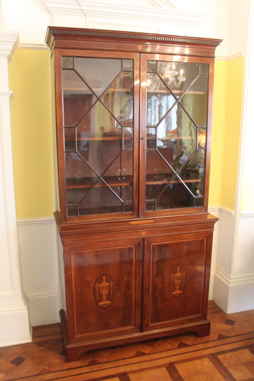 A late 19th Century inlaid mahogany Sheraton Revival library bookcase View II