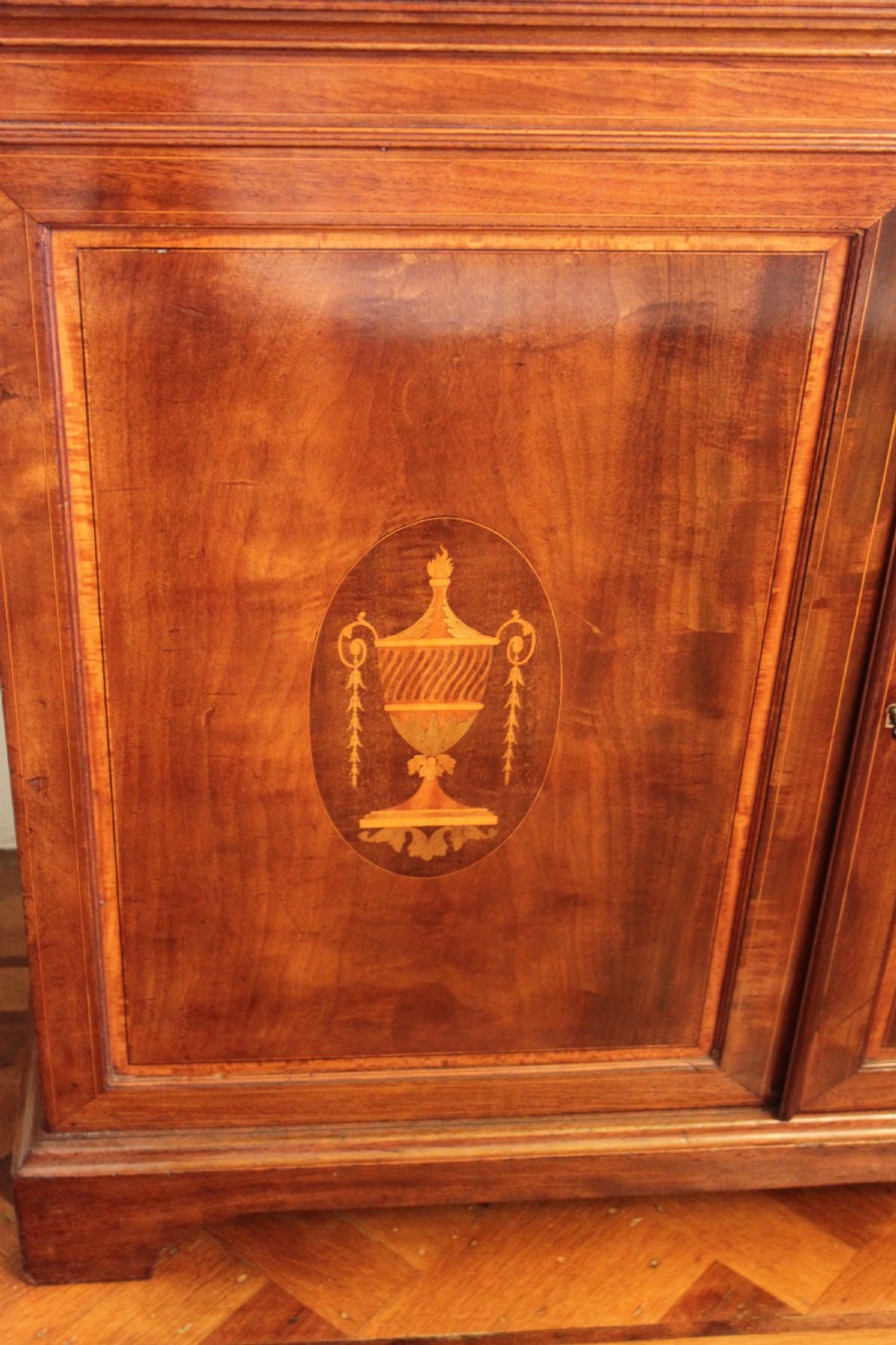 A late 19th Century inlaid mahogany Sheraton Revival library bookcase View V