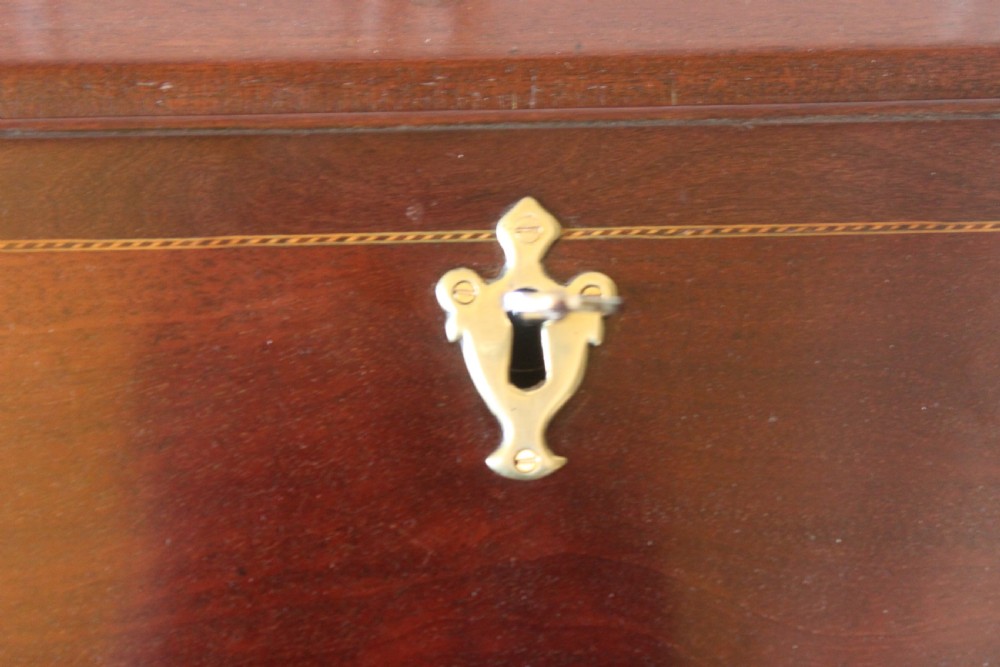 An 18th-century George III mahogany slant-front bureau featuring brass swan-neck handles and inlaid stringing over four graduated drawers. View XII