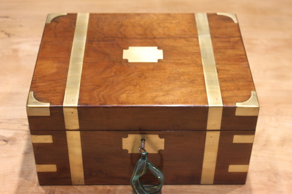 A small Victorian walnut writing slope with secret drawers