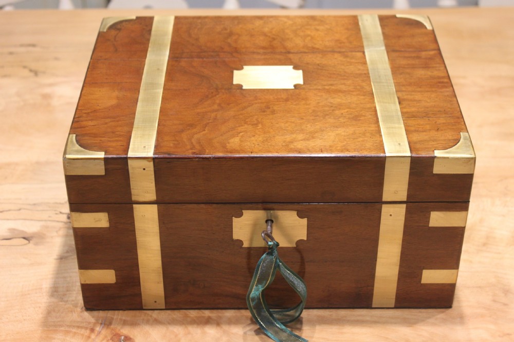 A small Victorian walnut writing slope with secret drawers View II
