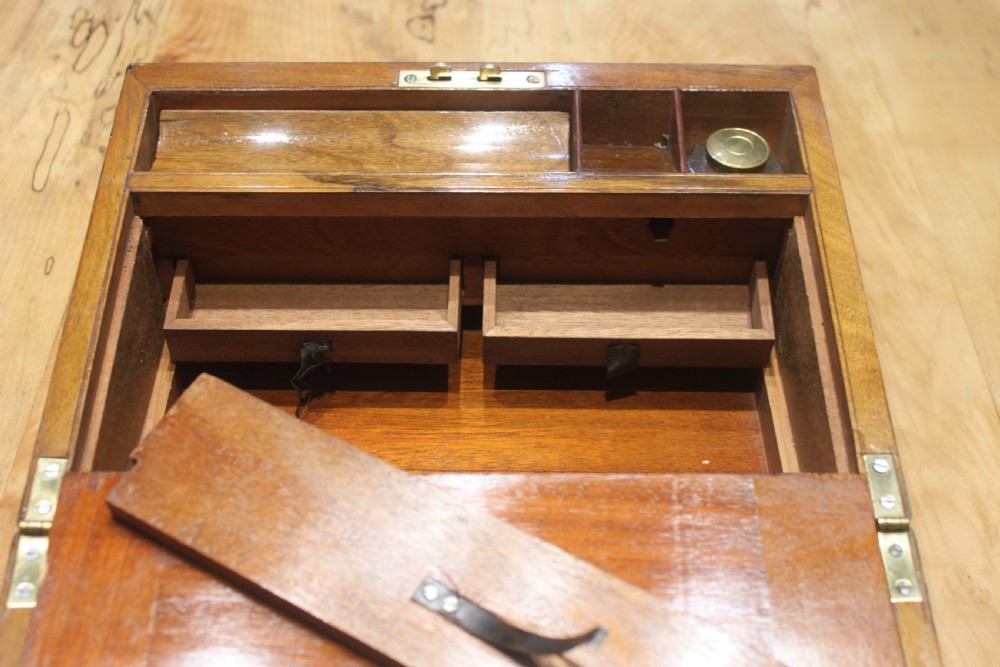 A small Victorian walnut writing slope with secret drawers View X