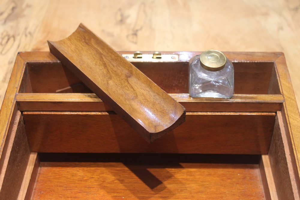 A small Victorian walnut writing slope with secret drawers View XI
