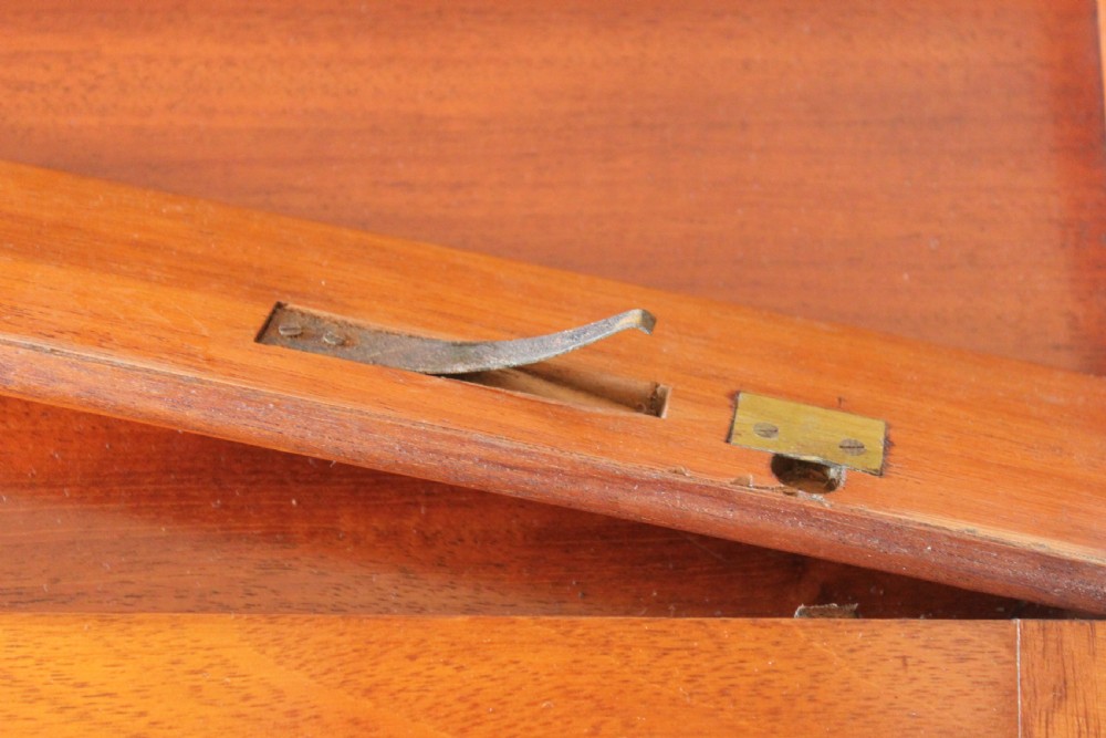 A rectangular Victorian burr walnut writing slope box featuring swirl veneer patterns, brass stringing inlay, a central engraved brass plaque, and a front keyhole escutcheon. View XIV