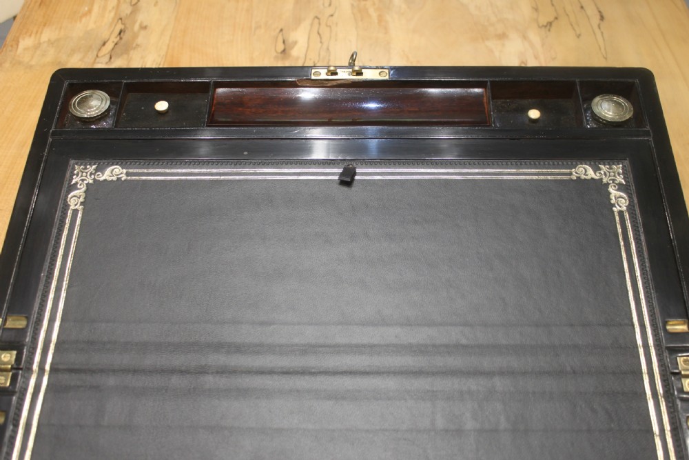 A large 19th century rosewood writing slope with brass inlay View X