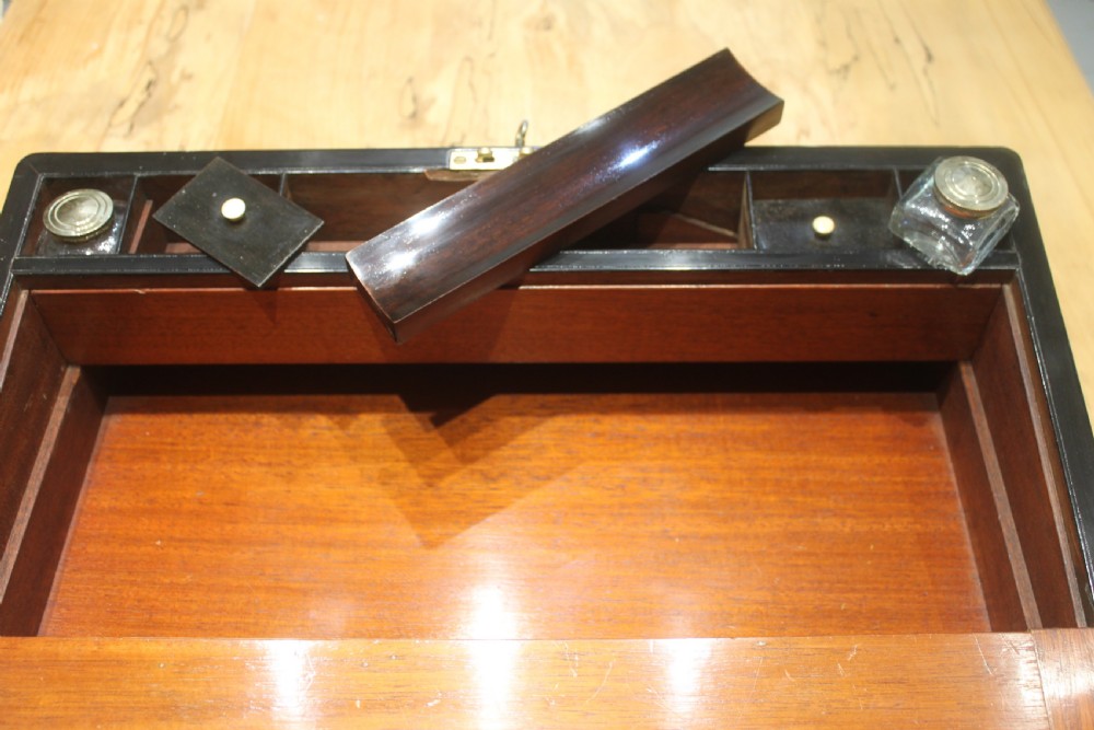A large 19th century rosewood writing slope with brass inlay View XIII