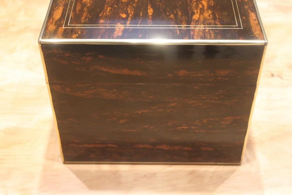 A rectangular Victorian coromandel wood dressing box with fine brass line inlay and a central monogram cartouche on the lid. View III