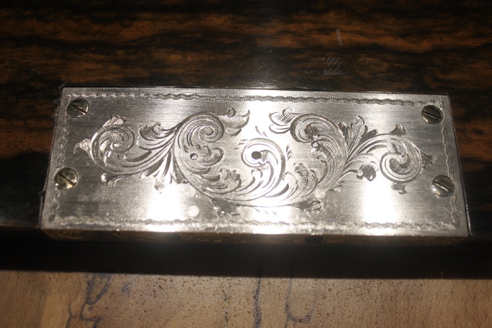 A rectangular Victorian coromandel wood dressing box with fine brass line inlay and a central monogram cartouche on the lid. View IX