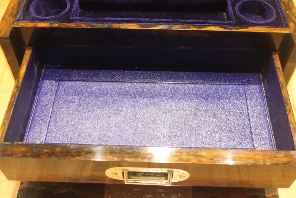 A rectangular Victorian coromandel wood dressing box with fine brass line inlay and a central monogram cartouche on the lid. View XI