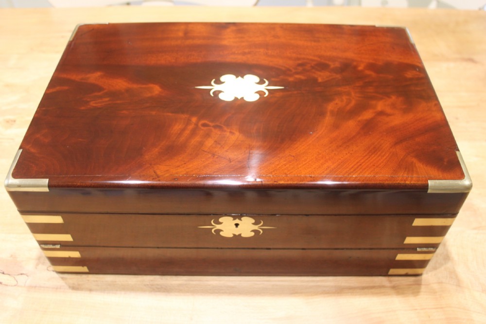 A large and impressive early 19th century mahogany campaign writing slope