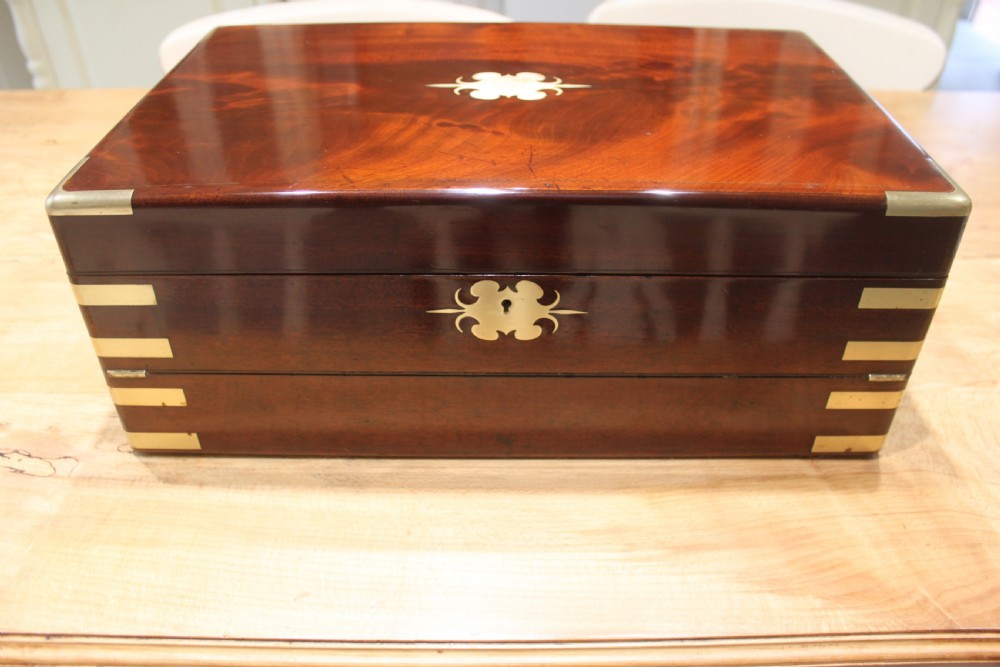 A large and impressive early 19th century mahogany campaign writing slope View II