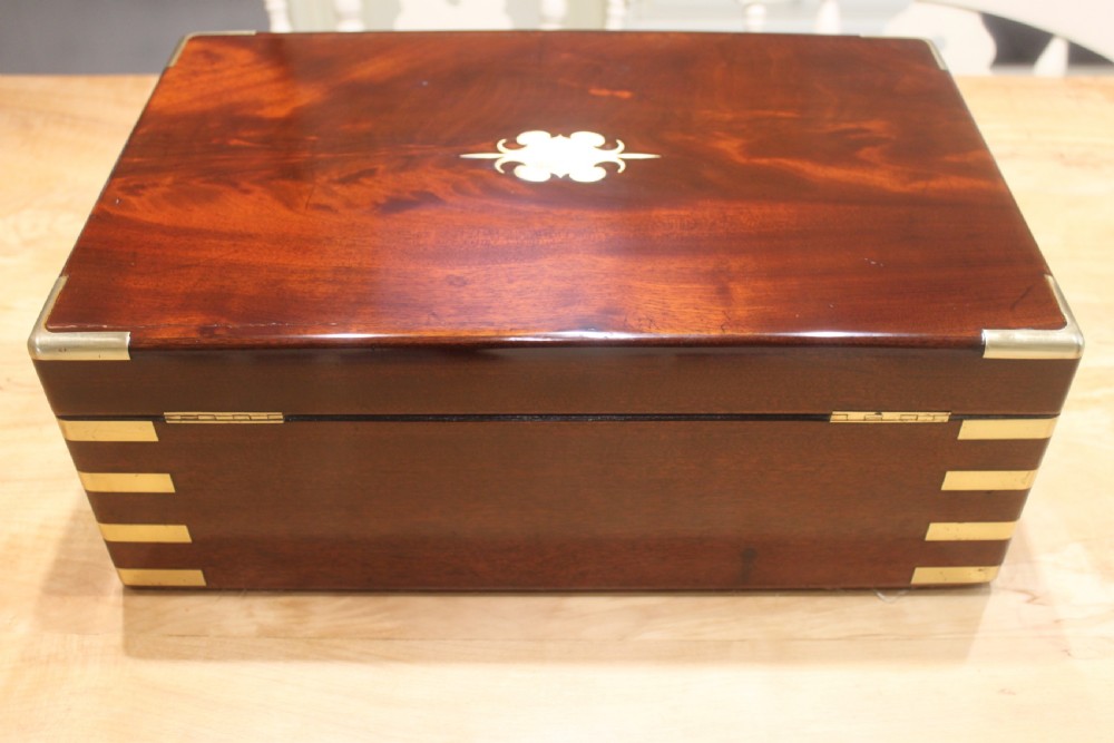 A large and impressive early 19th century mahogany campaign writing slope View III