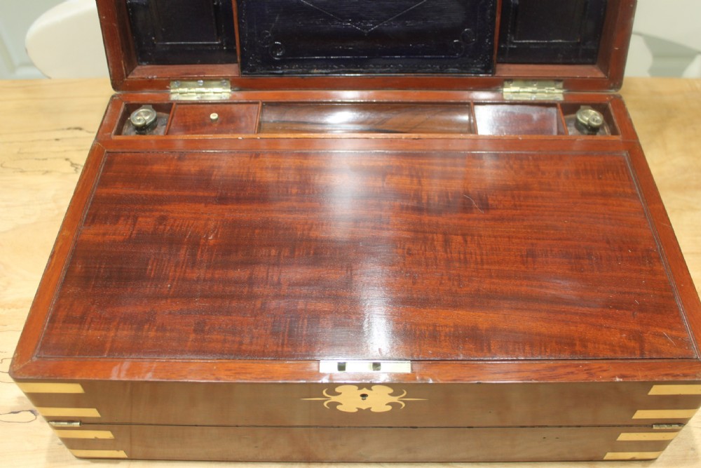 A large and impressive early 19th century mahogany campaign writing slope View VI