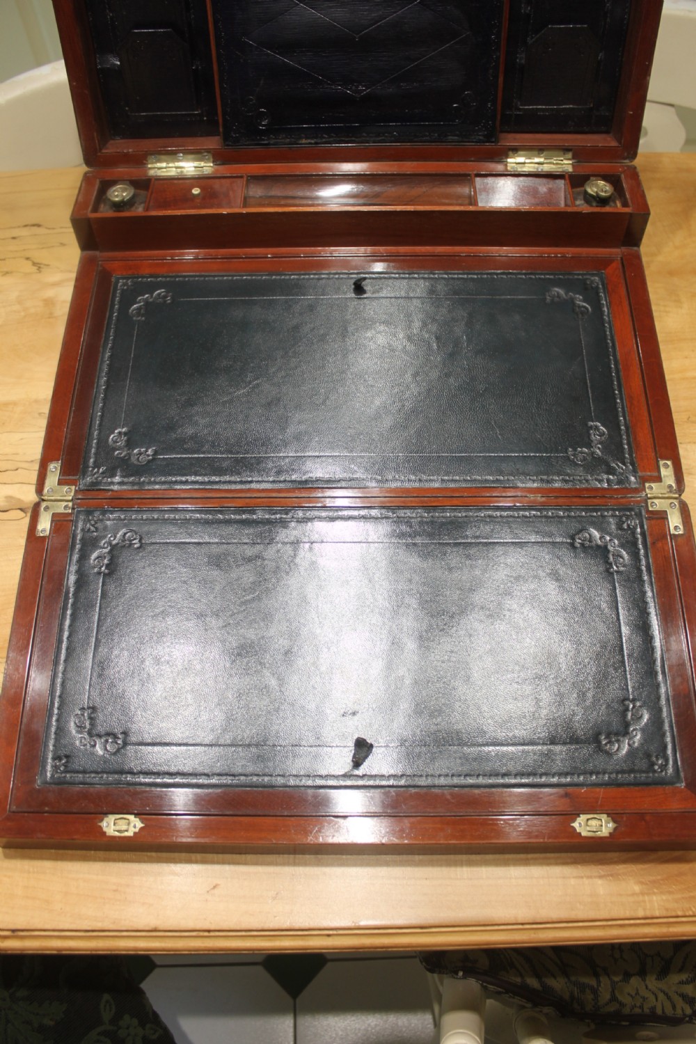 A large and impressive early 19th century mahogany campaign writing slope View X