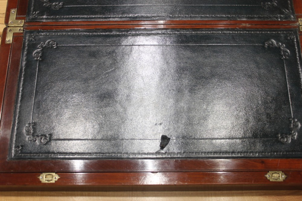 A large and impressive early 19th century mahogany campaign writing slope View XI