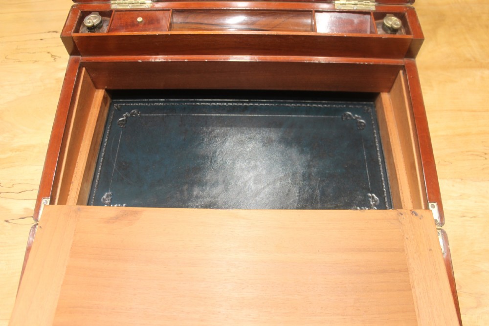 A large and impressive early 19th century mahogany campaign writing slope View XIII
