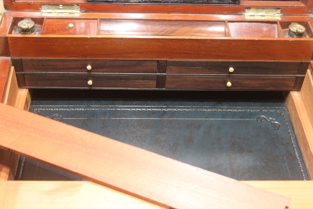 A large and impressive early 19th century mahogany campaign writing slope View XVI