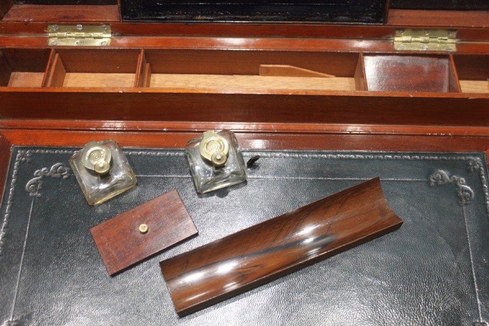 A large and impressive early 19th century mahogany campaign writing slope View XVIII