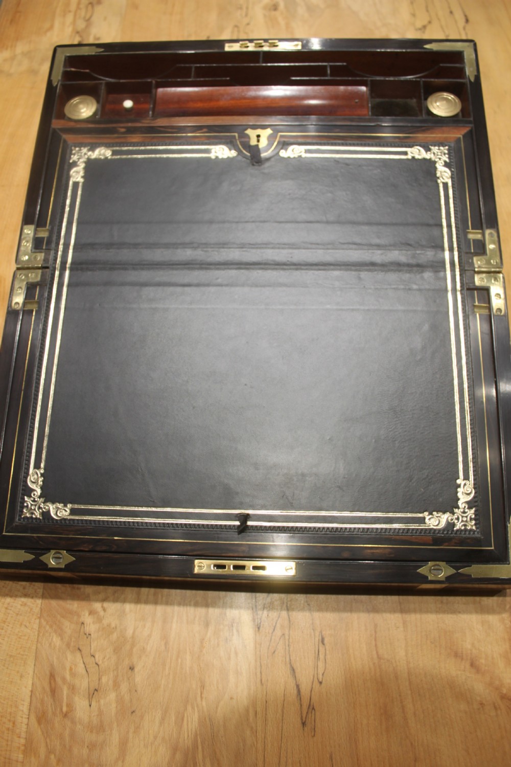 A quality walnut writing slope with stationery compartments, secret drawers etc. View V