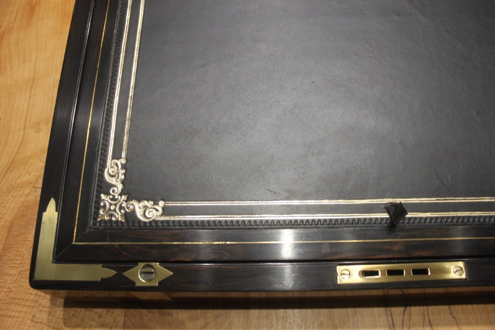 A quality walnut writing slope with stationery compartments, secret drawers etc. View VI
