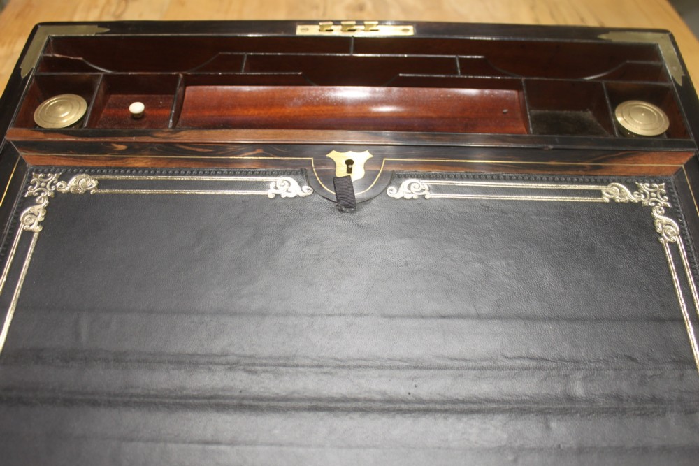 A quality walnut writing slope with stationery compartments, secret drawers etc. View VII