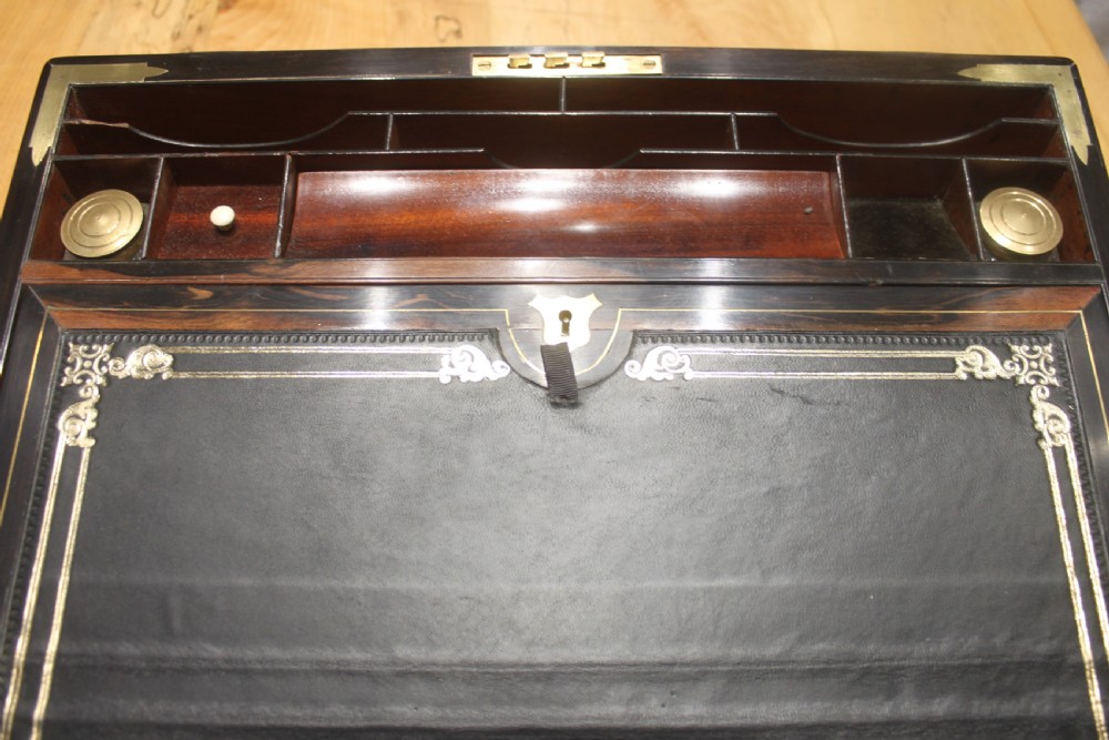 A quality walnut writing slope with stationery compartments, secret drawers etc. View X