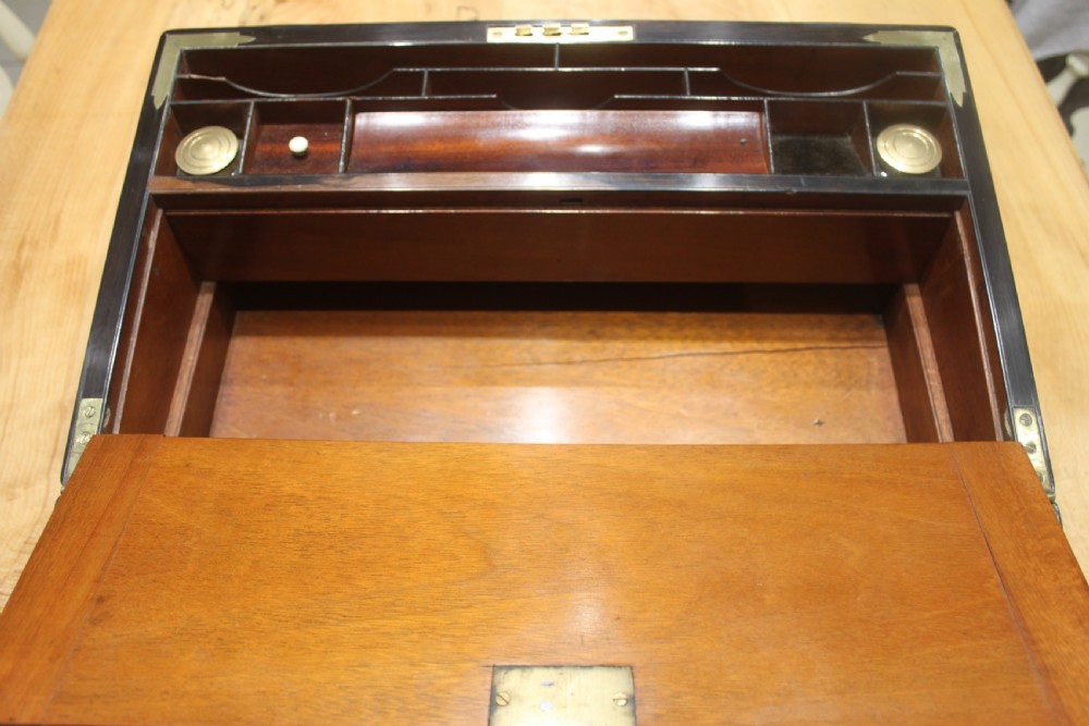 A quality walnut writing slope with stationery compartments, secret drawers etc. View XI