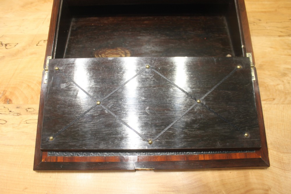 A dark rosewood rectangular writing slope box decorated with intricate mother-of-pearl foliate floral inlay and a central keyhole escutcheon. View VIII