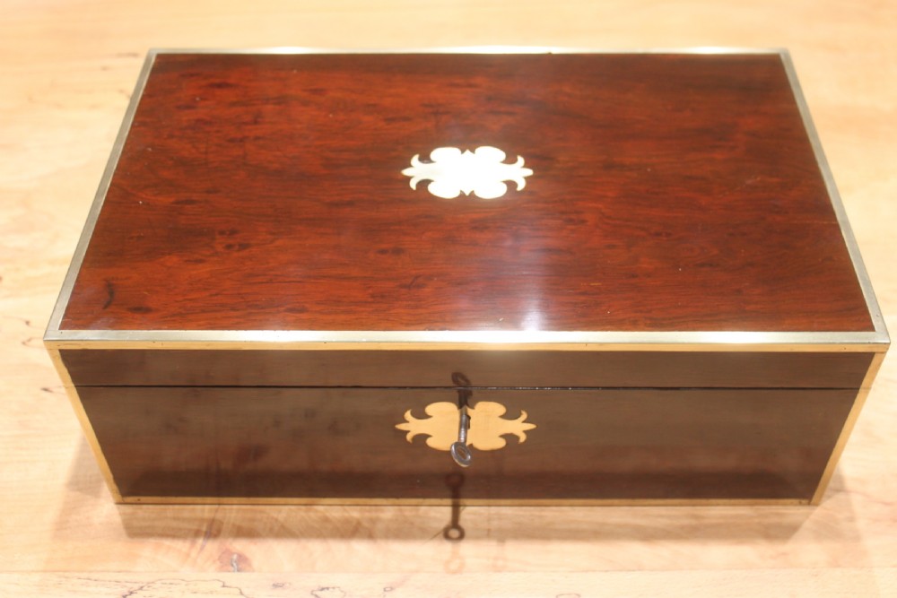 A Brass Bound Writing Slope with a fitted interior to include Inkwells, Pen...	
