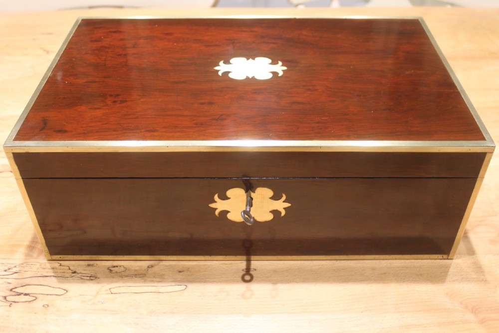 A Brass Bound Writing Slope with a fitted interior to include Inkwells, Pen...	 View II