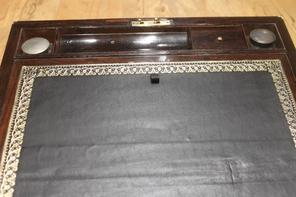 A Brass Bound Writing Slope with a fitted interior to include Inkwells, Pen...	 View VIII