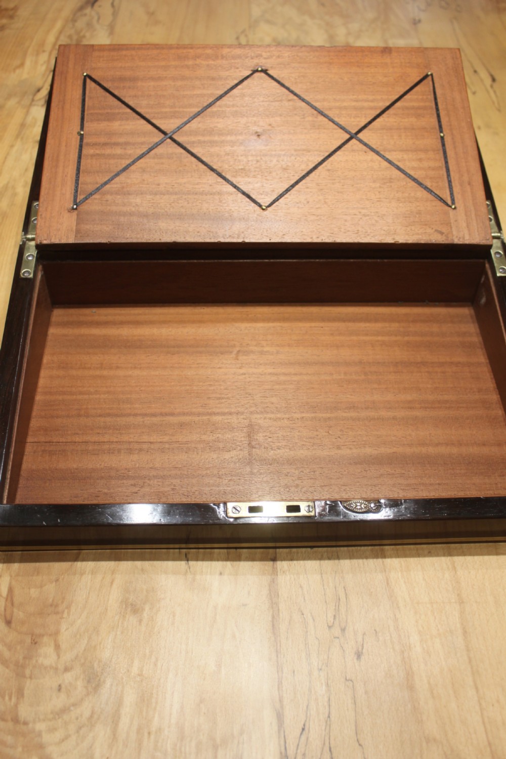 A Brass Bound Writing Slope with a fitted interior to include Inkwells, Pen...	 View IX