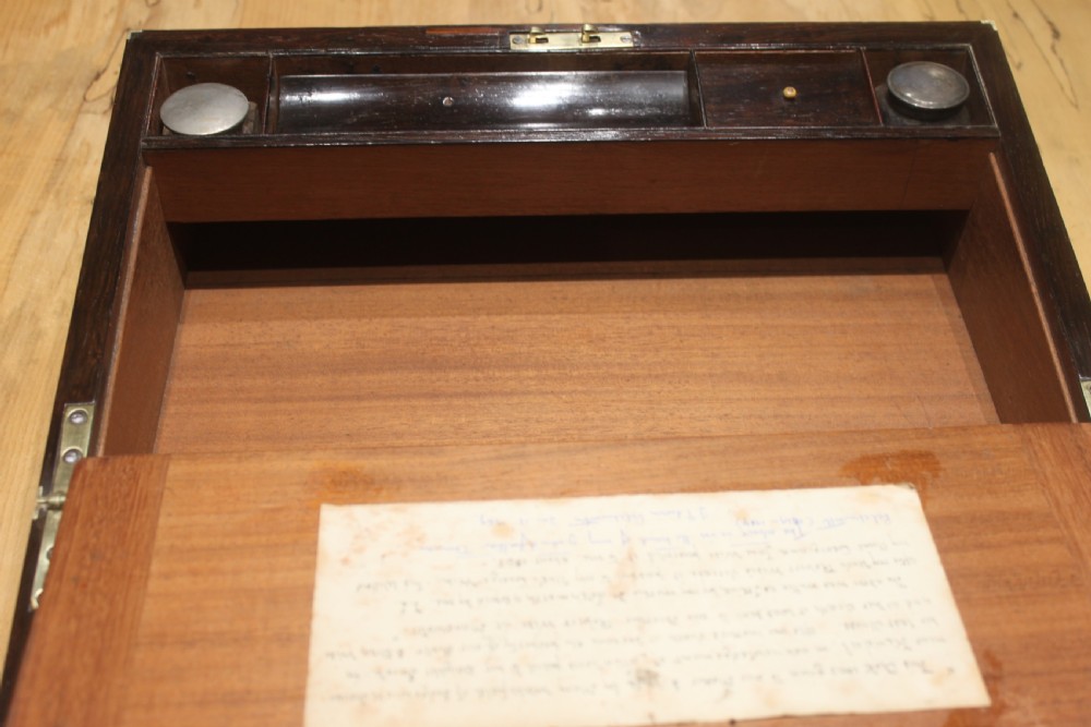 A Brass Bound Writing Slope with a fitted interior to include Inkwells, Pen...	 View X