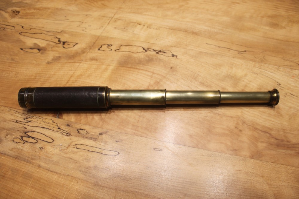 A brass pocket telescope by C Barrett, London